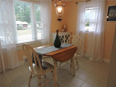 Dining room loaded with charm has a...