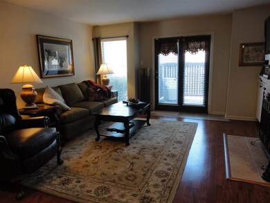 This great room is large, has hardwood floors and 