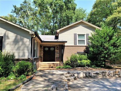 Another view of the front! Beautiful mature trees throughout! 