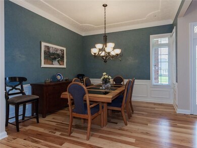 Dining Room accented with crown molding, chair rail & wainscot, decorative ceiling treatment & corner windows can be formal or informal to suit your style and/or needs. Space could also be a fantastic Sitting or Music Room.
