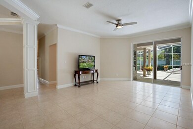 Living room leads to screened lanai.  19x13