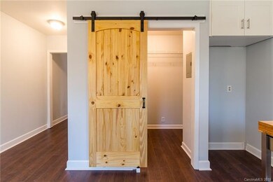 Laundry room/pantry with new custom barn door.