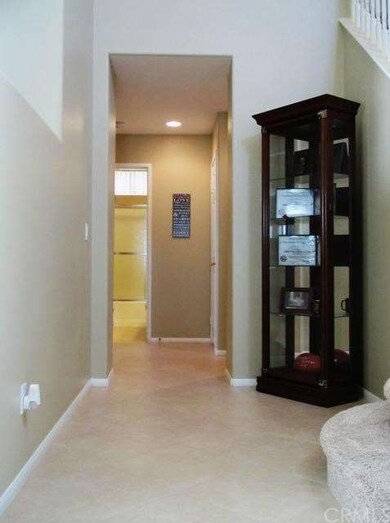 Wide Hallway leading to Downstairs Bathroom, downs