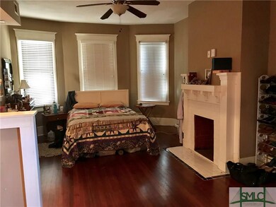Front room currently being used as a bedroom area.