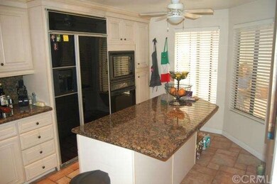 Added center island is great for food prep or casu