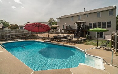 A view across the pool toward the rear of the hous
