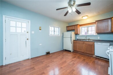 Kitchen provides access to rear porch with stairs