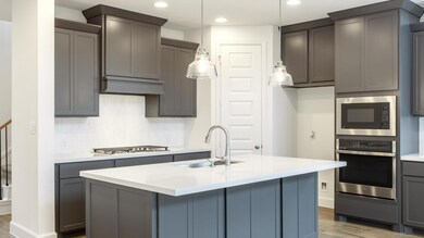 Kitchen with a sink, decorative backsplash, wood 