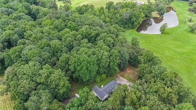 Aerial overview of property's location with a large body of water