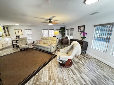 Combo Living and Dining area with built in shelves and storage