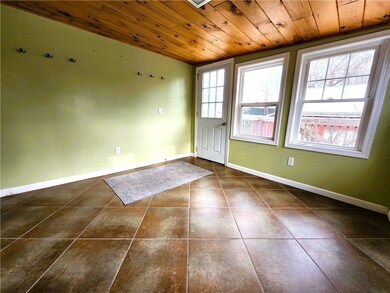 Tiled porch/mudroom off back deck .