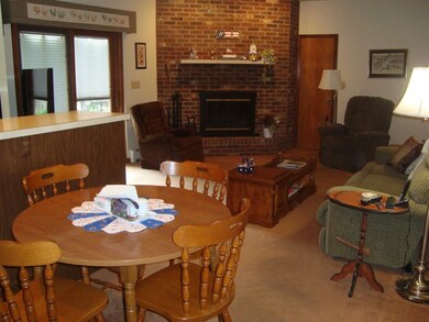 Breakfast nook overlooks the family room. The fire