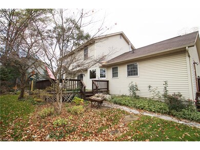 back yard deck, there is a small fish pond next to
