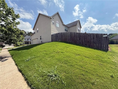 View of side of home with a garage