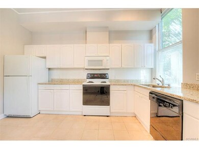 Large, eat-in kitchen w/ granite, tile floor, open