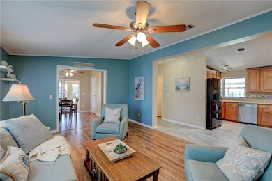 Living room opens to kitchen