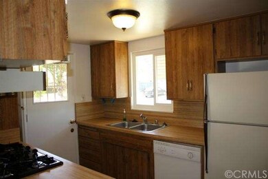 Sunny kitchen with inside laundry and furnace, gas