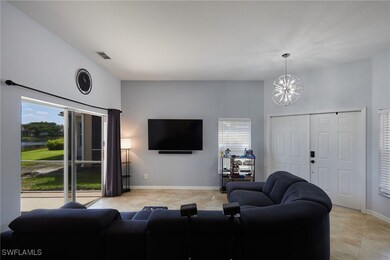 Living area with a chandelier, light tile patterne