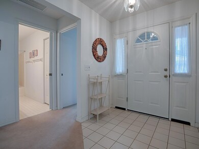 LIGHT AND BRIGHT TILED FOYER