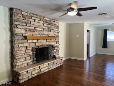 Unfurnished living room featuring a ceiling fan, a