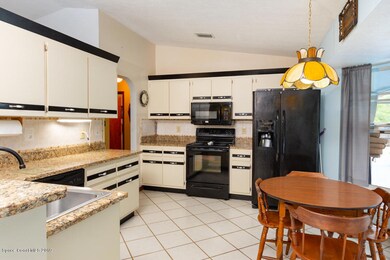 Kitchen with granite counters.