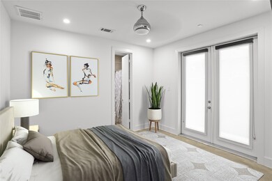 The first floor bedroom features recessed lighting