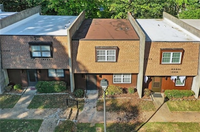 View of front facade featuring a shingled roof