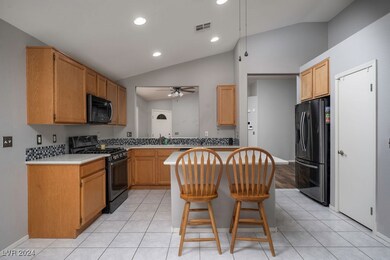 Kitchen with Island & Black Stainless Steel Applia