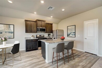 The open-concept kitchen overlooking the entertain
