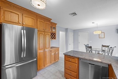 View from the kitchen to the attached garage and access to the full basement.