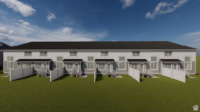 Back of house with a lawn and a shingled roof