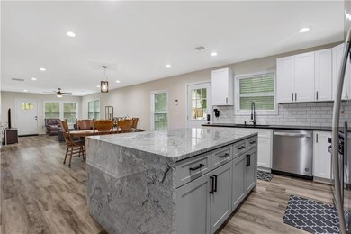 Kitchen featuring visible vents, dishwasher, a sin