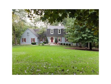 Front Exterior. Nestled on 1.4 acres of trees and 