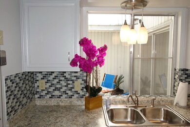 Updated, bright kitchen with designer back splash,