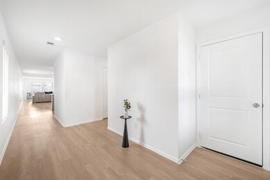 this home entry includes a wide foyer for welcomin