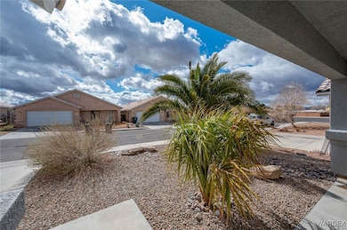 View of yard featuring a garage