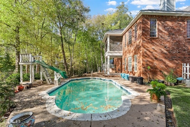 Swimming pool with a balcony and a patio area