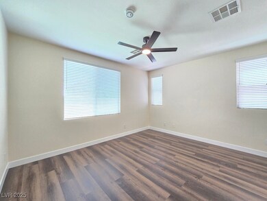 Spare room with ceiling fan, dark wood-style floor