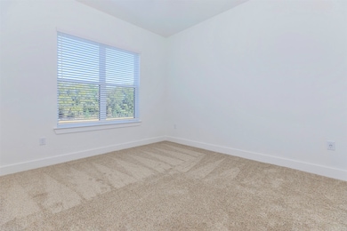 Spacious bedroom with large window