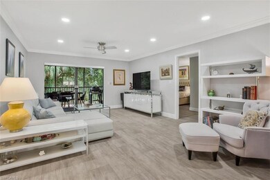 Living room with light hardwood / wood-style floor