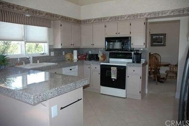 Grabite in kitchen and has eating area plus walk o