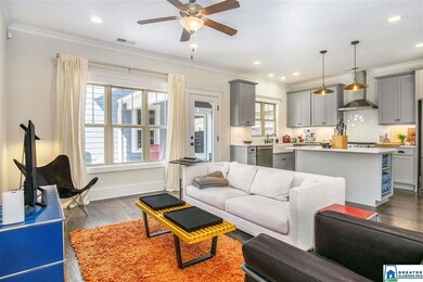 The living room opens to the gorgeous kitchen and 