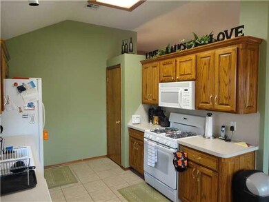 Kitchen. Pantry, tile floor, and freestanding gas 