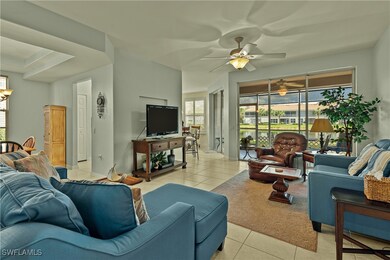 Tiled living room featuring ceiling fan