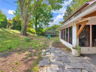View of yard featuring a patio area and a trampoli