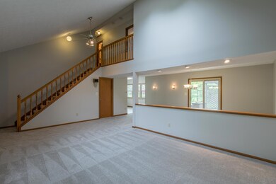 Living room has vaulted ceiling