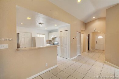 Kitchen area, arched entryways