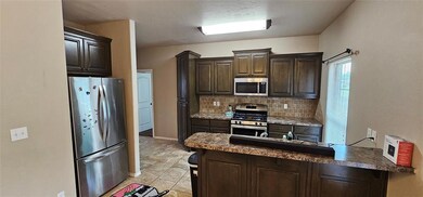 Stainless fridge is property of tenant