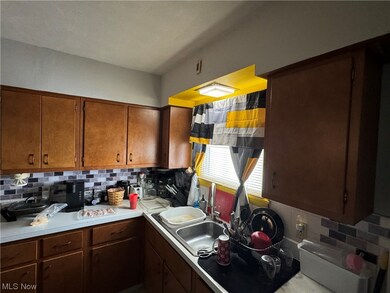 Kitchen featuring tasteful backsplash and sink