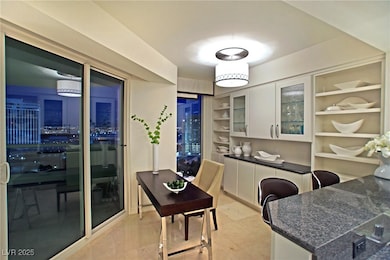 Office area featuring marble finish floor and buil